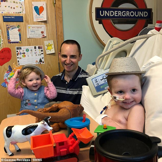 He spent three months in intensive care. Pictured here with little sister, Georgia, two, and father Michael