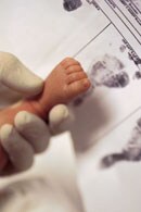 newborn getting foot printed